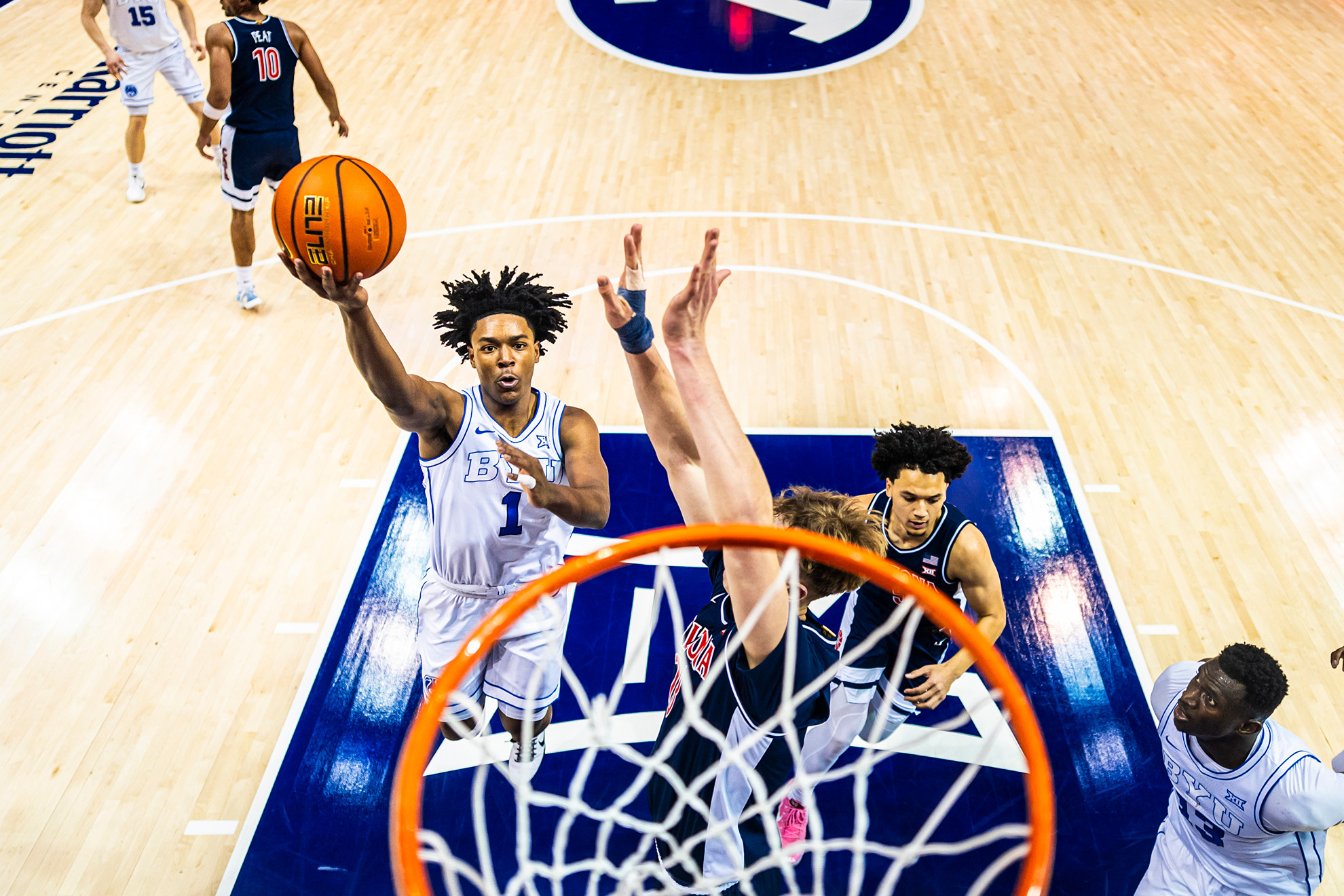 Robert Wright III goes to the basket against Arizona.
