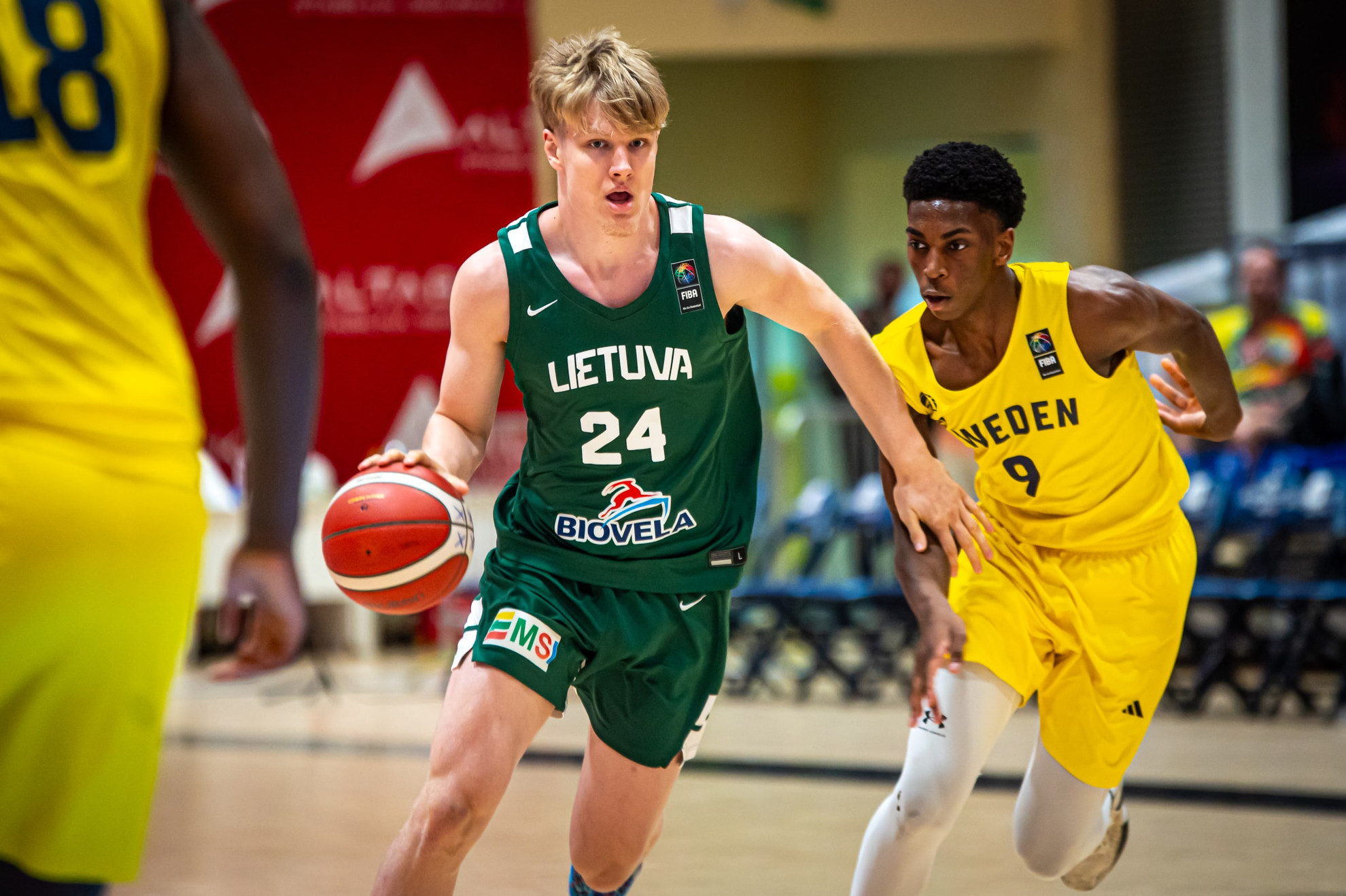 Dovydas Buika drives to the basket during FIBA Eurobasket play.
