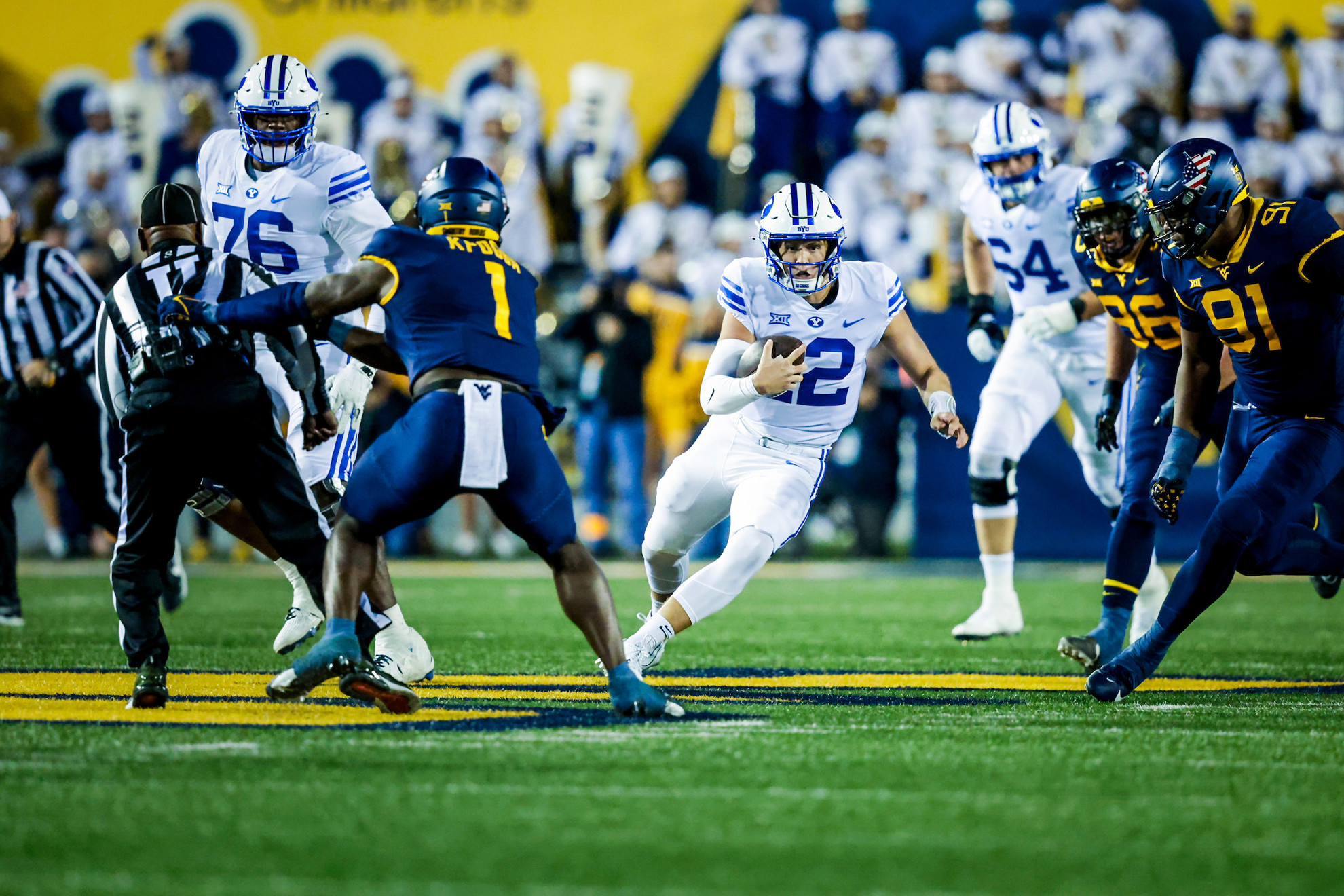 WVU player holding on the referee?