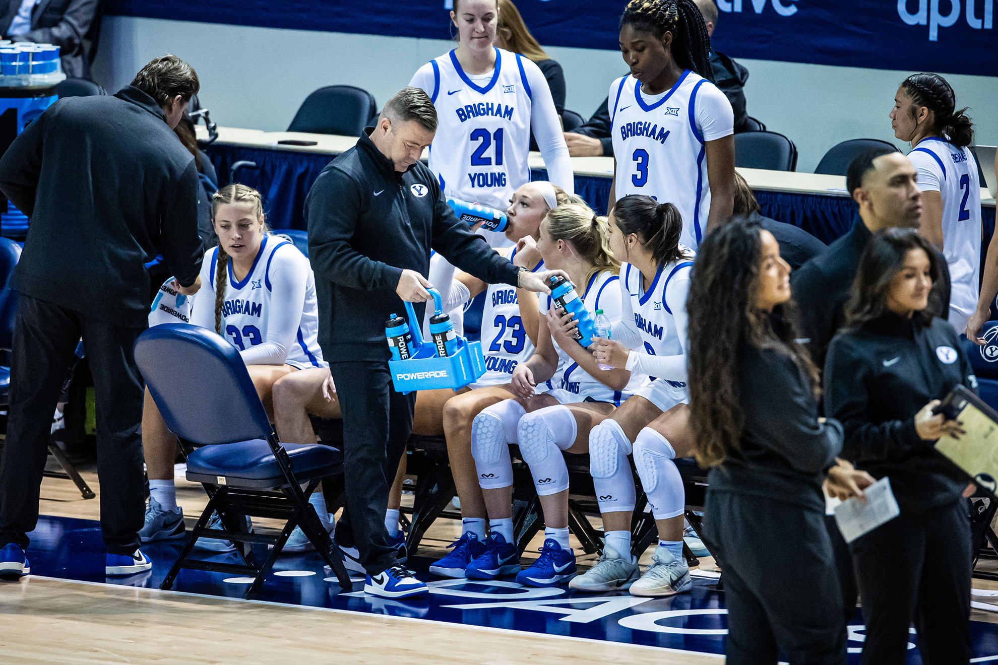 25-26wBKB vs Western Colorado Exhibition 096.jpg Jeff Hurst hands out water during a timeout in a BYU women's basketball games.