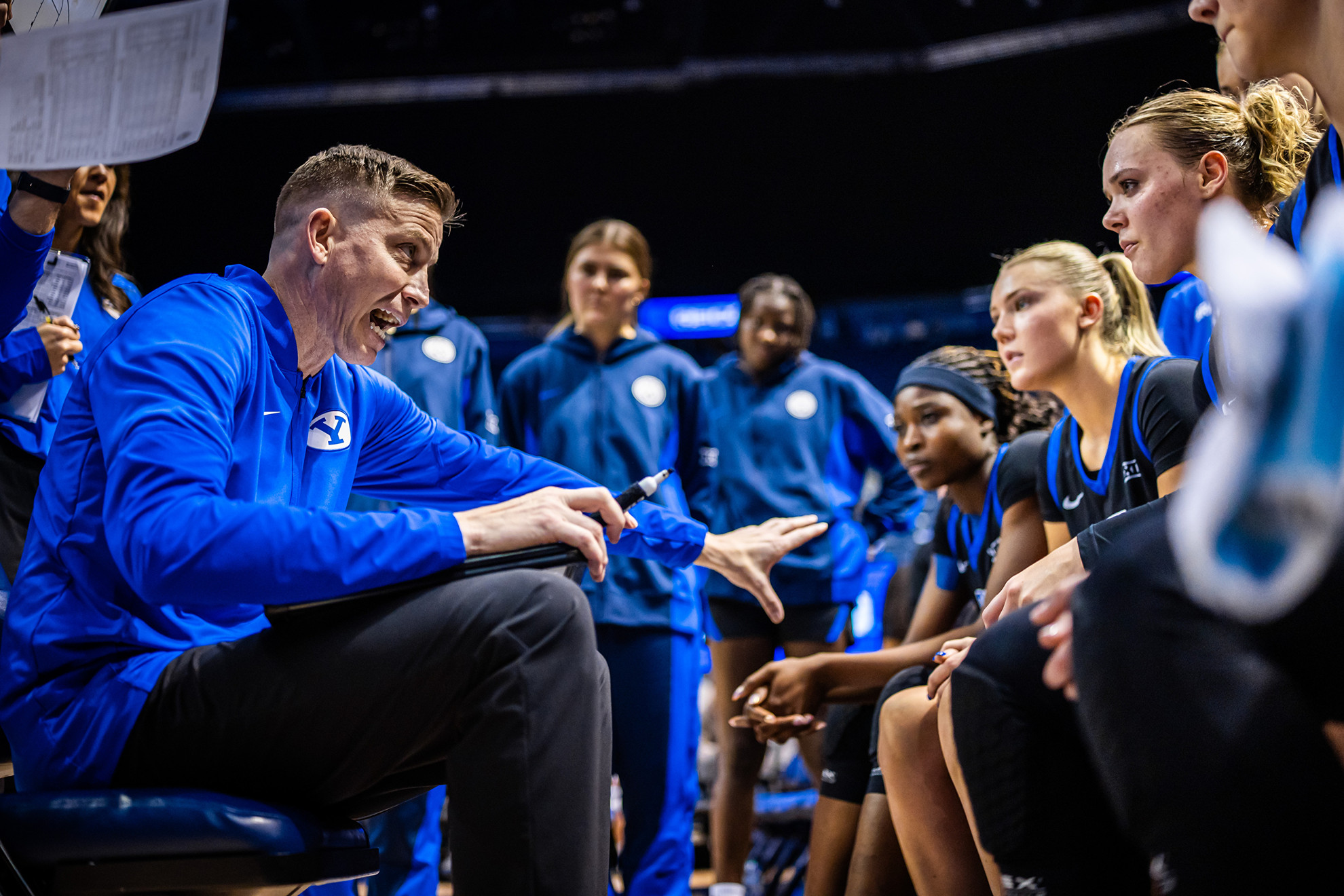 25-26wBKB vs Texas Tech 279.jpg Lee Cummard instructs his team in a huddle during a BYU women's basketball game against Texas Tech