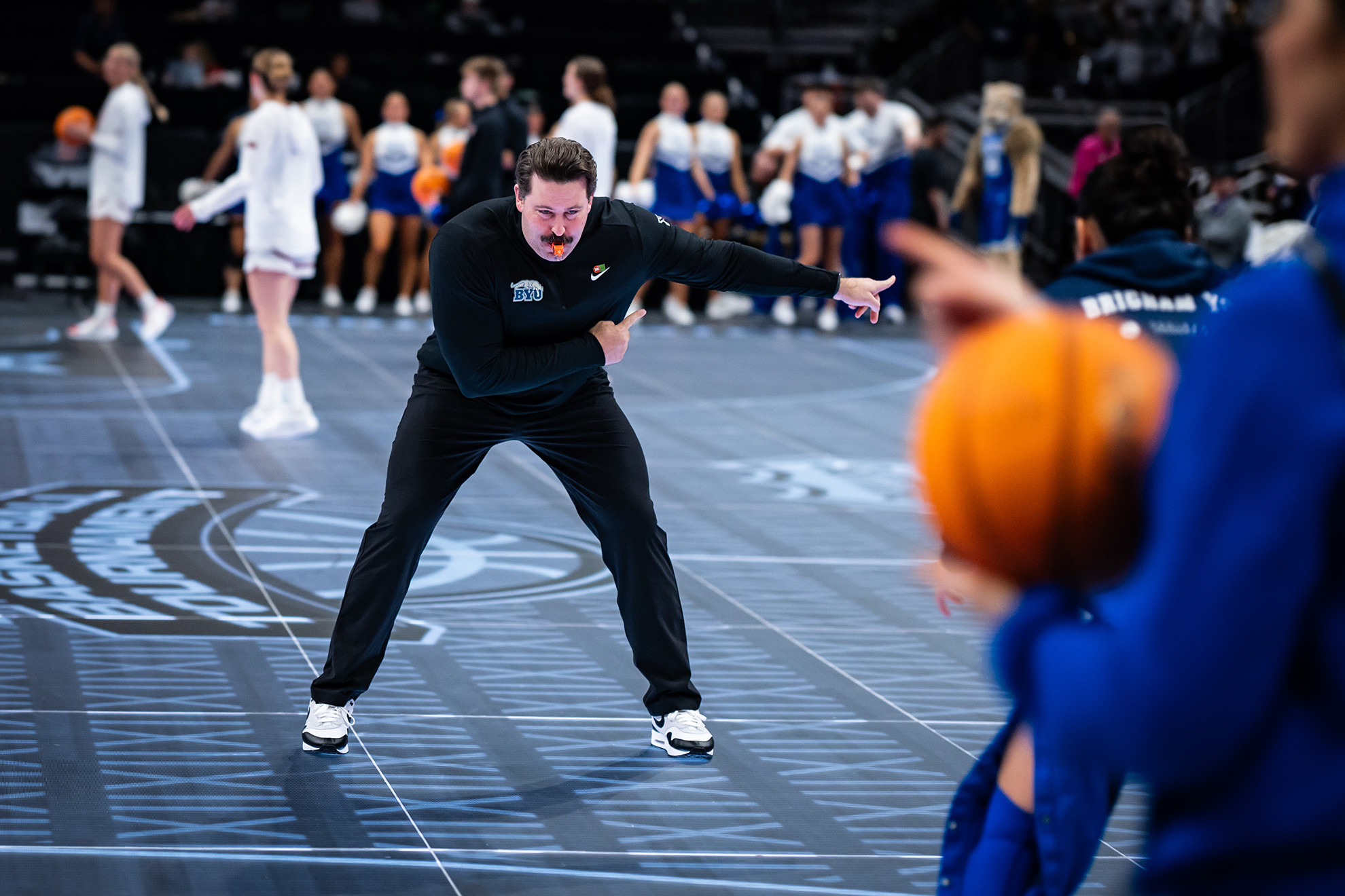 25-26wBKB BIG XII vs Utah 0119.JPG Steven Arnold runs warm ups ahead of BYU's women's basketball game against Utah at the Big 12 Tournament.
