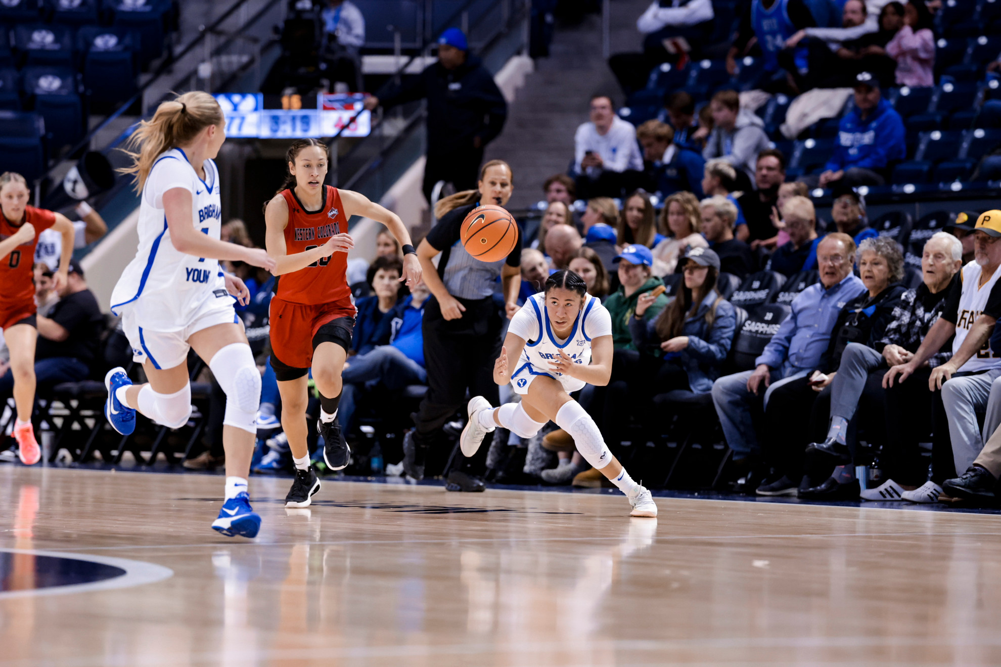 Sydney Benally throws a pass to Olivia Hamlin during BYU's women's basketball game against Western Colorado.