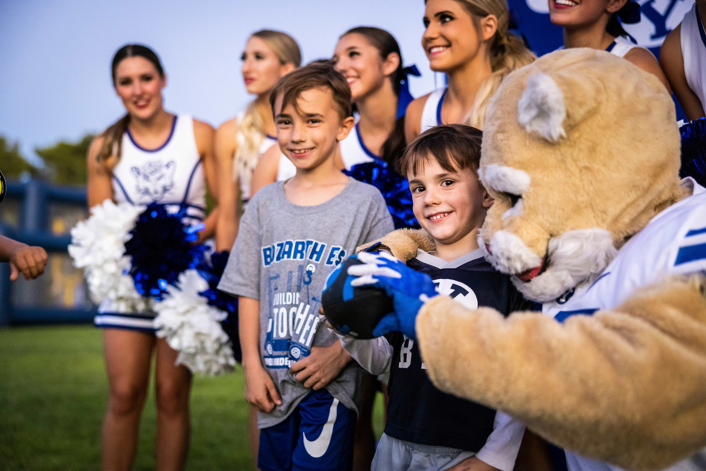 BYU Cosmo the Cougar with happy kids